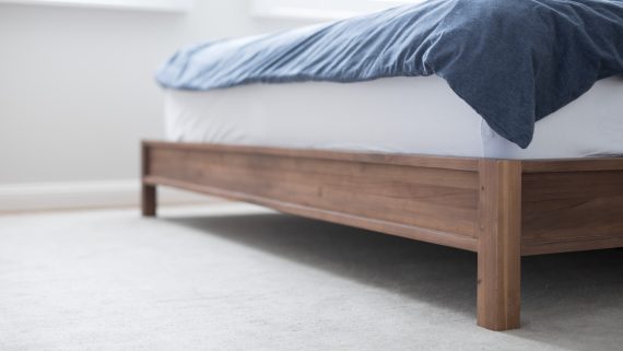 in-a-bedroom-cleaning-helping-with-household-duties-tasks-maid-bed-rug-carpet-room-bright-light_t20_e93omW