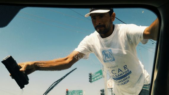 stopped-at-a-red-light-guy-jumps-on-my-truck-and-started-cleaning-my-windshield_t20_G48gk0